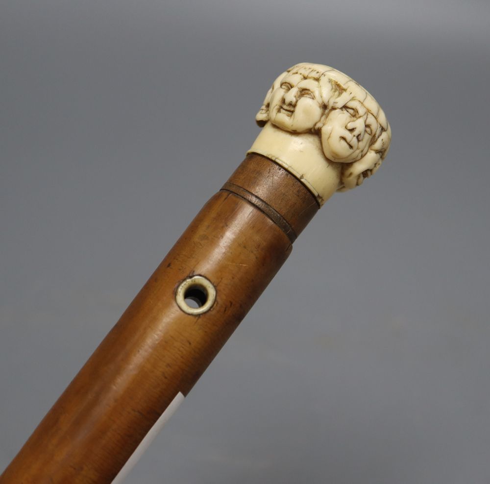 A late 19th century ivory mask handled walking cane, overall length 92cm